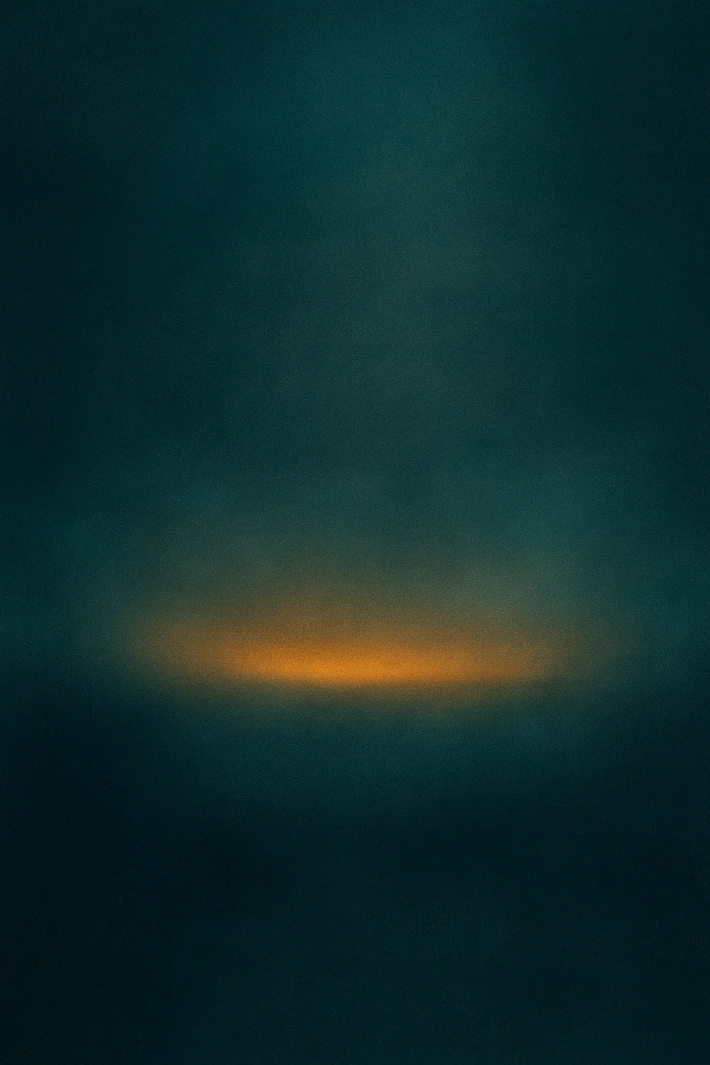 Amber-gold light band drifting through deep indigo-teal mist